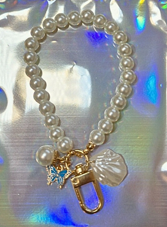 Pearl and butterfly binder charm