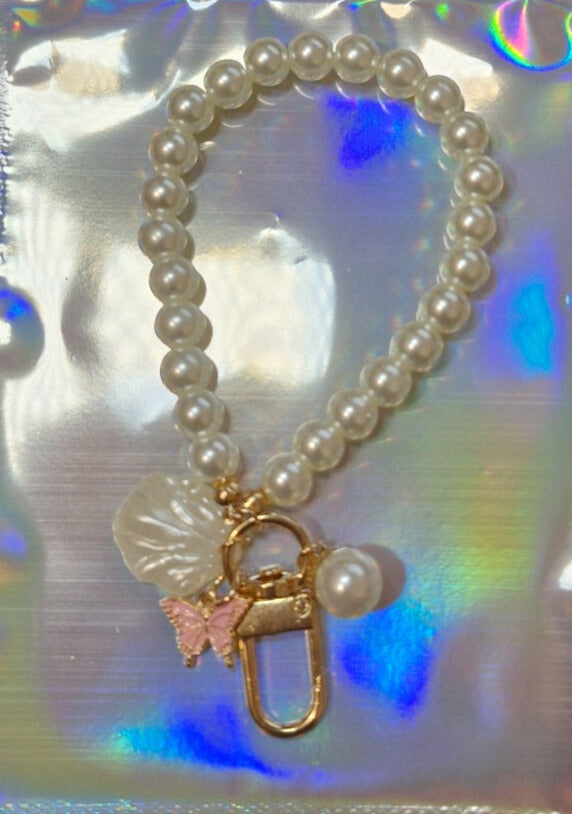 Pearl and butterfly binder charm