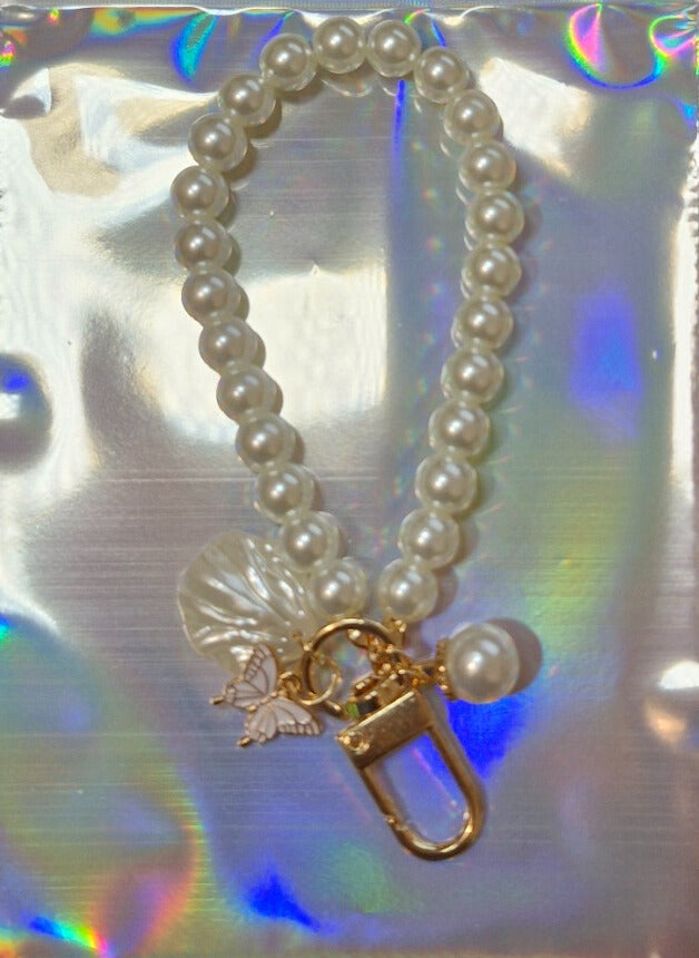 Pearl and butterfly binder charm